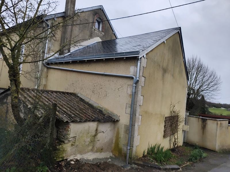 Toiture en ardoise et gouttières en zinc